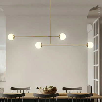 Decorbites minimalist gold finish pendant light with four opal glass bulbs and brass bulb base in geometric design