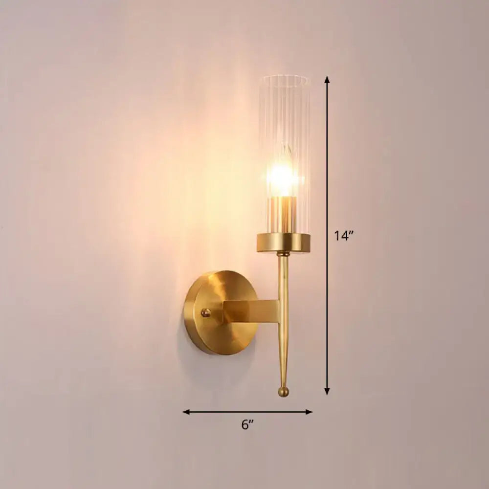 A sleek modern gold wall lamp with fluted clear glass cylinder housing an exposed bulb 110v 240v 220v-240v 110v-120v
