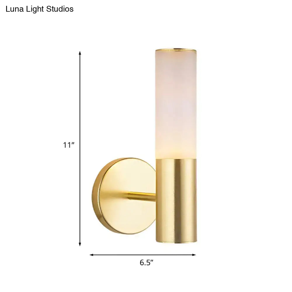 Modern gold wall lamp with frosted glass diffuser in cylindrical design for bedroom sconce lighting