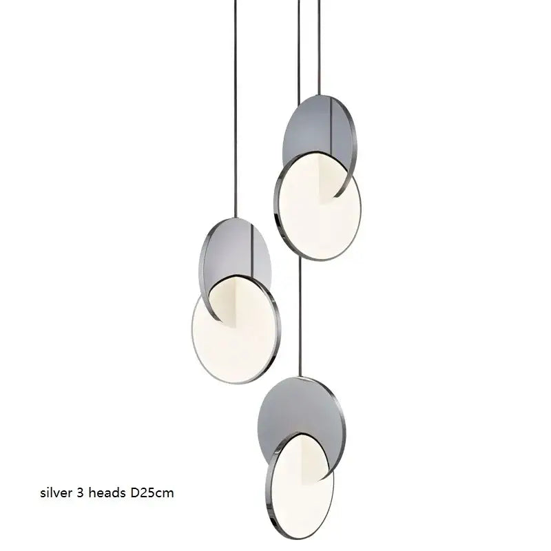 Silver pendant light with three geometric circle heads featuring sleek metallic frames and soft diffused illumination decorbites geometric circle