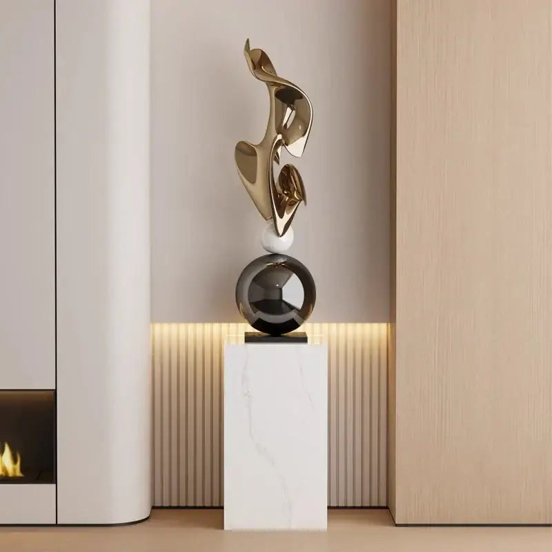 Modern gold geometric electroplating art sculpture with flowing curves on black spherical base for living room decor