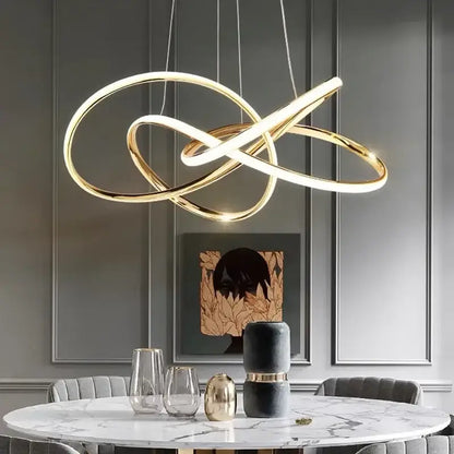 Modern gold-toned infinity loop pendant light with sleek design for dining room by decorbites geometric led ceiling