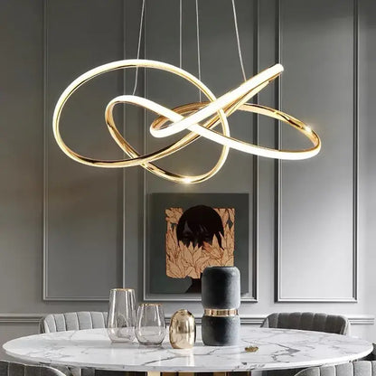 Modern gold geometric line led chandelier with intertwined circular rings and sleek minimalist design for dining room decorbites geometric line