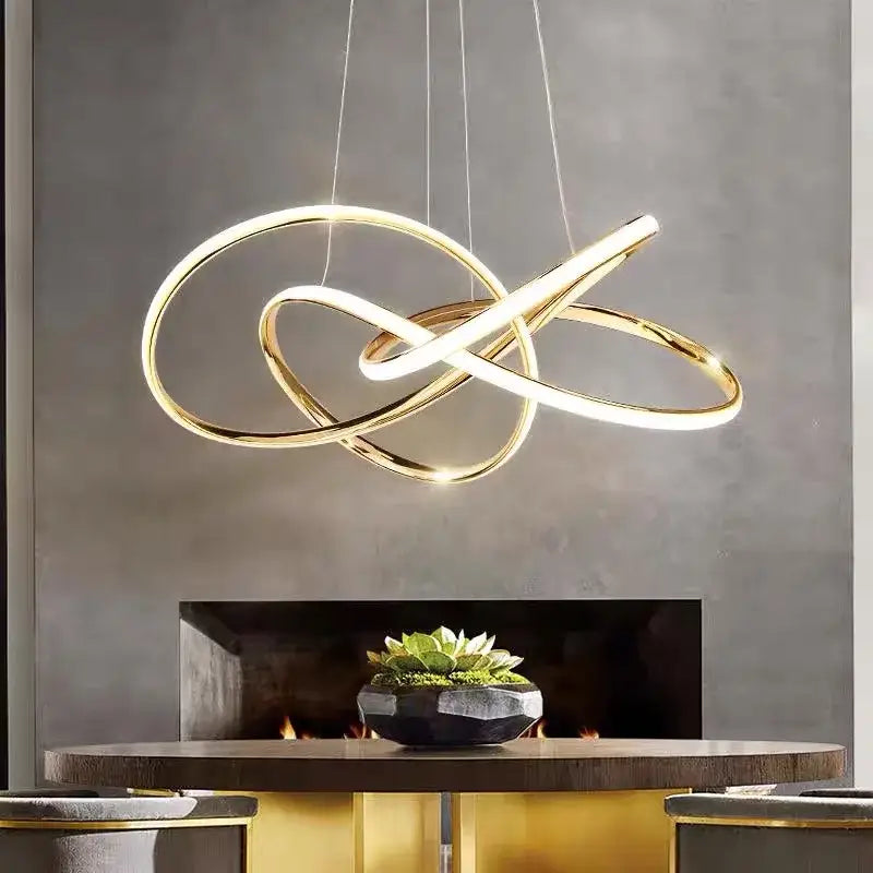 Modern gold geometric line led chandelier featuring intertwined circular rings for dining room decorbites geometric line