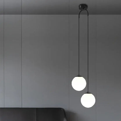 Modern gold glass ball dual head pendant light with two frosted glass globes and black cords for bedroom decorbites glass ball