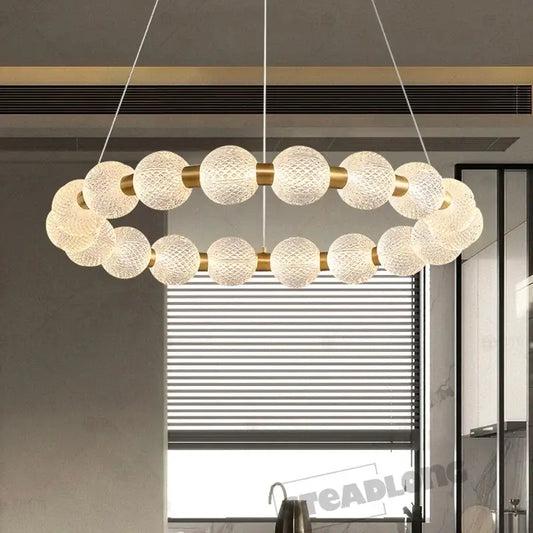 Modern gold glass ball led ceiling chandelier with textured white glass spheres and gold-toned metal connectors decorbites glass ball