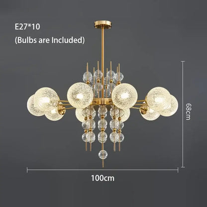 Modern gold glass ball pendant chandelier with ten frosted glass globe bulbs and clear crystal accents for kitchen island