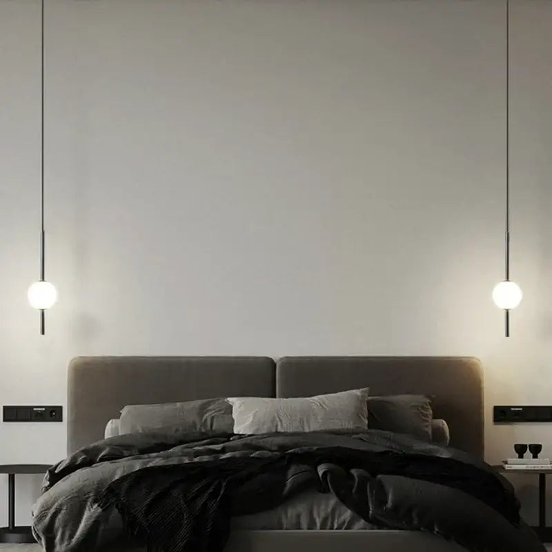 Modern gold glass ball pendant light with sleek black cords and white glass ball shades for bedroom decorbites pendant light