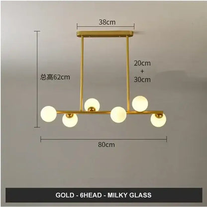 Modern gold glass balls chandelier featuring six spherical milky glass fixtures for dining room decorbites glass balls design
