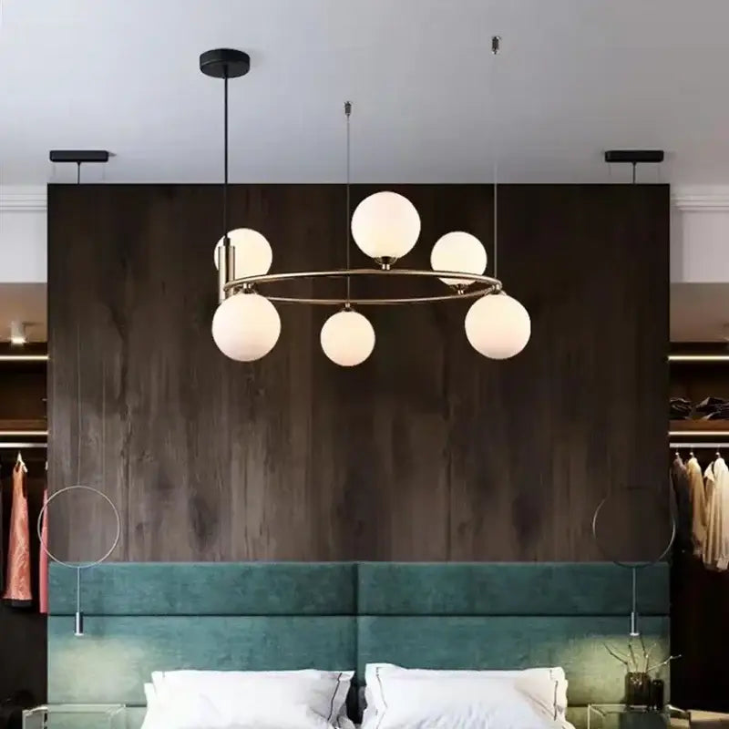 Modern gold glass chandelier g9 hanging light with circular brass frame and six frosted glass globe bulbs for living room