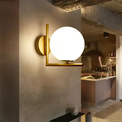 Modern gold glass globe wall lamp with a spherical frosted glass globe for bedroom decorbites glass globe wall lamp