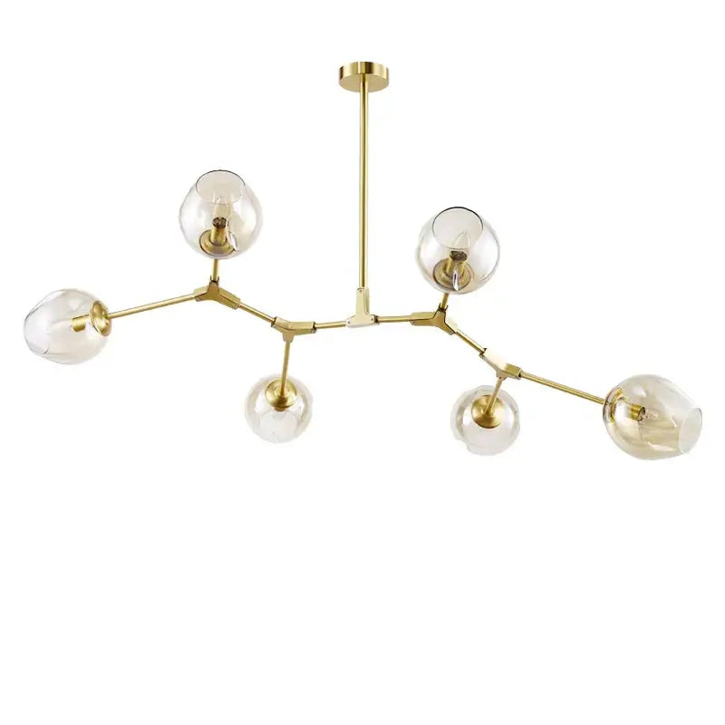 Modern gold glass pendant lights with six clear glass globes and a branching metal frame for dining room use