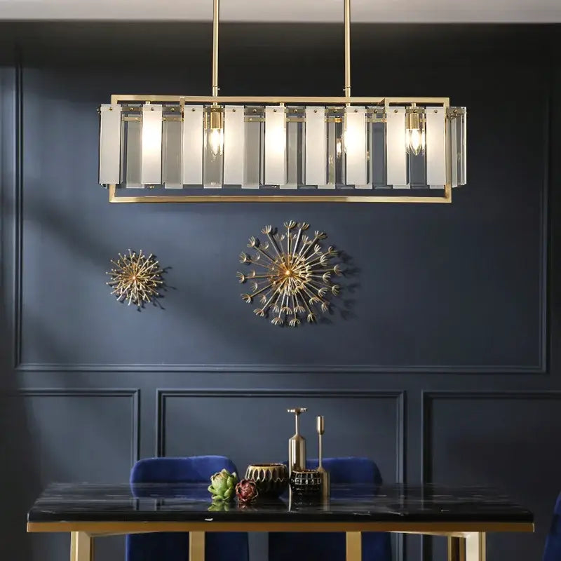 Modern gold glass restaurant chandelier with rectangular pendant light, clear glass panels, and exposed bulbs for dining room luxury