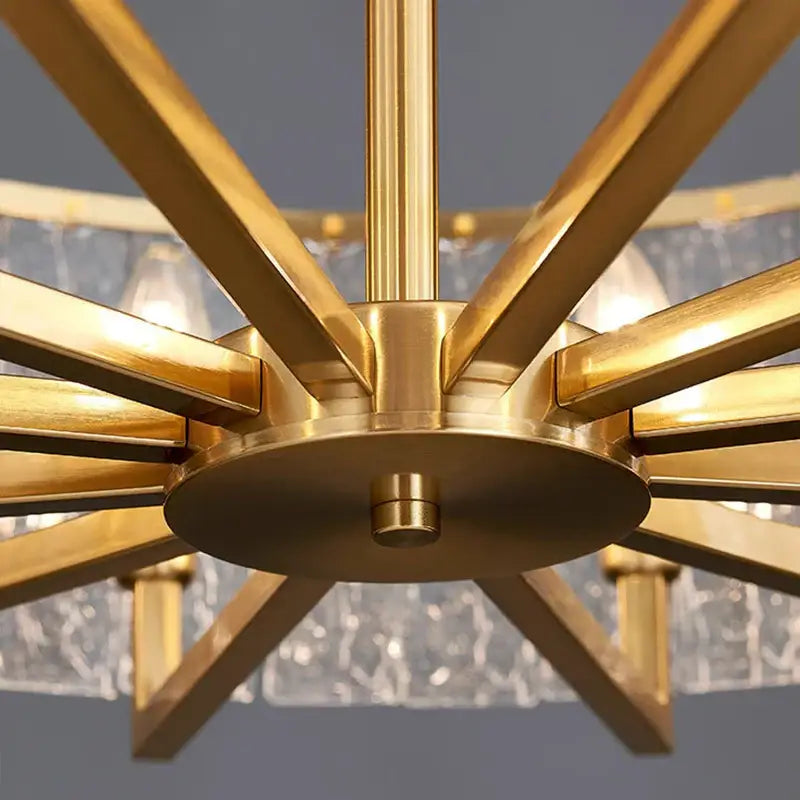 Modern gold glass restaurant chandelier with brass-finished starburst design and clear textured glass shades for dining room luxury light