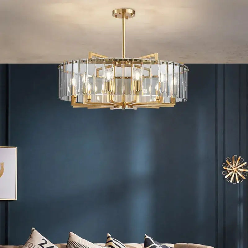 Modern gold glass restaurant chandelier with circular metal frame and clear crystal panels for luxury dining room light