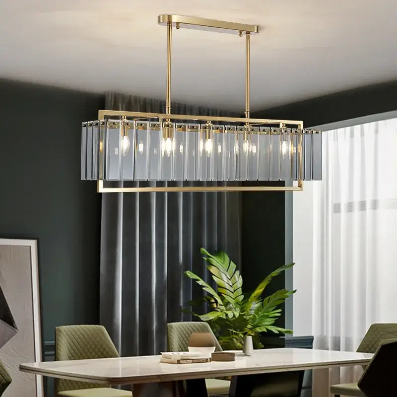 Modern gold glass restaurant chandelier with rectangular metal frame and vertical frosted panels for luxury dining room