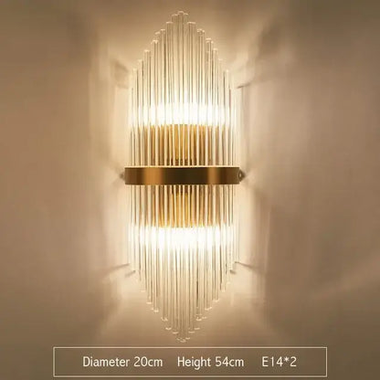 Modern gold wall sconce featuring clear glass rod crystal arranged in a vertical fan pattern for bedroom lighting