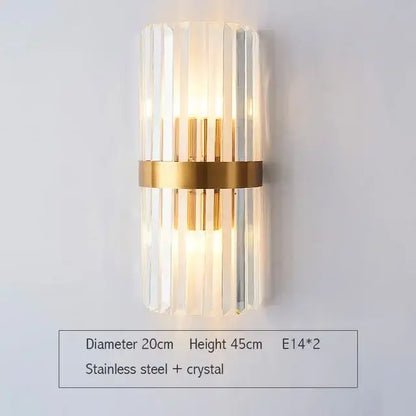 Modern gold wall sconce with vertical glass rod crystal and stainless steel band for elegant bedroom lighting