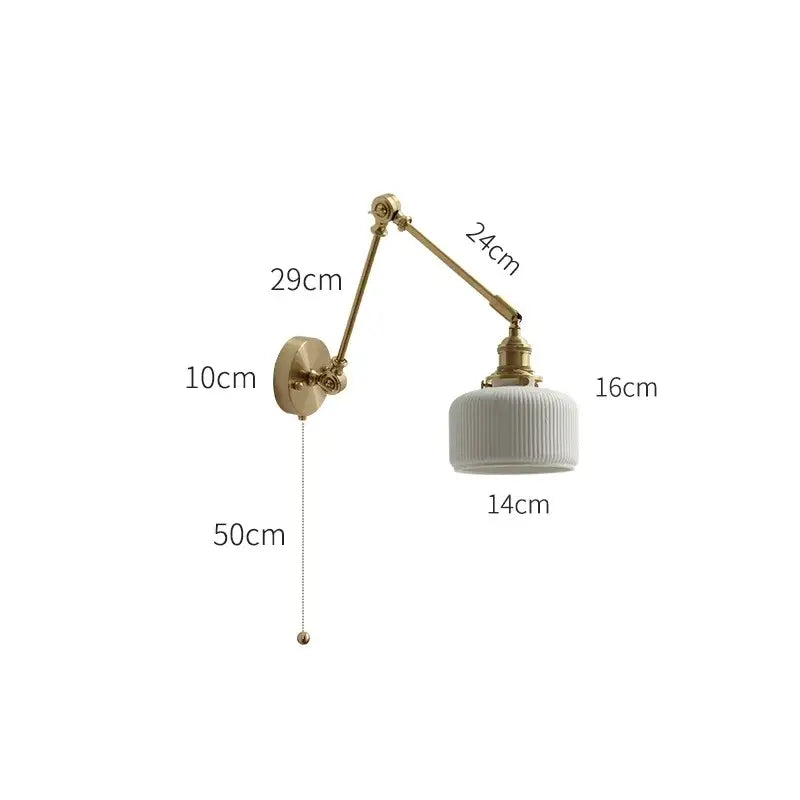 A vintage-style brass wall light with a white ribbed ceramic glass shade and adjustable arm for bedroom use