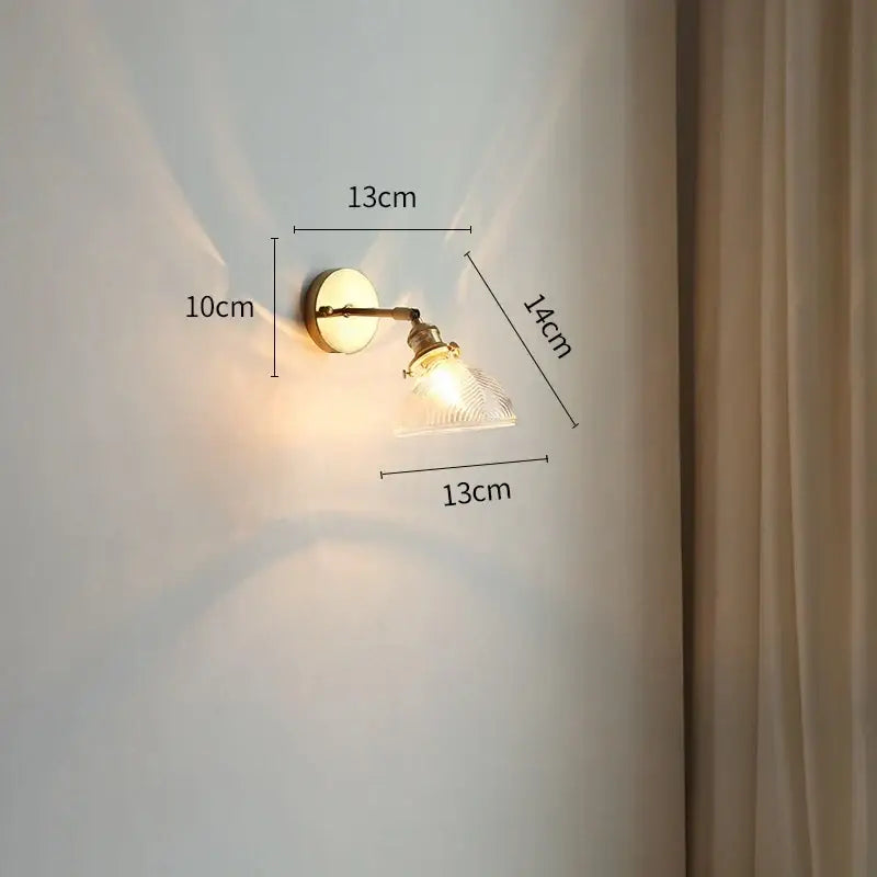 Vintage-style brass led wall light with modern gold clear textured glass shade and bedroom pull chain switch