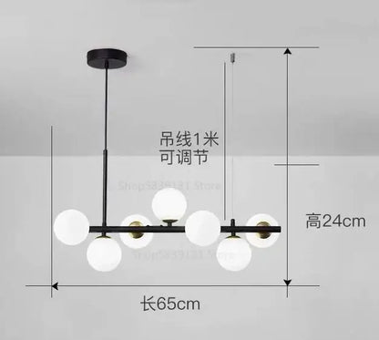 Modern black metal pendant light chandelier with seven frosted white glass globe bulbs in a linear design for dining room