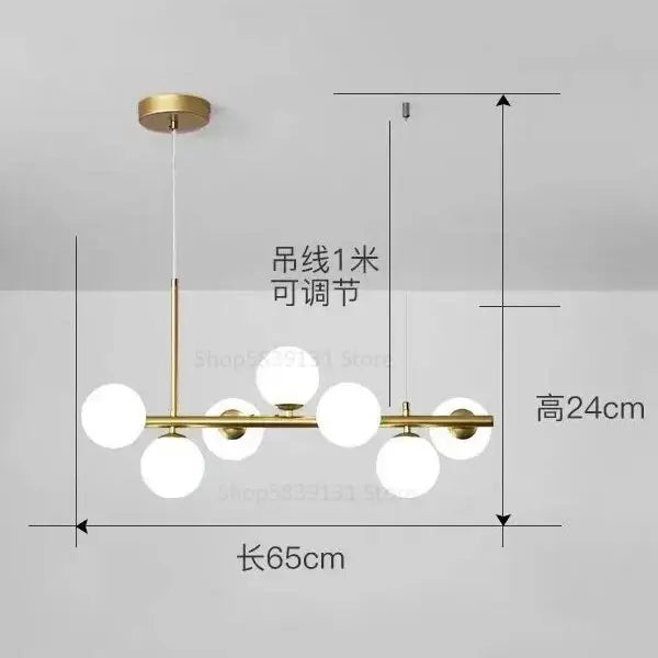 Modern gold globe pendant light chandelier with six frosted glass globes in brass linear design for dining room