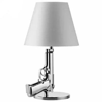 Chrome finished pistol-shaped gun floor lamp with white conical shade for modern decorbites floor lamp design