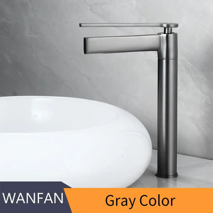Gray metallic basin faucet with sleek modern design and tall cylindrical base for decorbites brass deck mounted use
