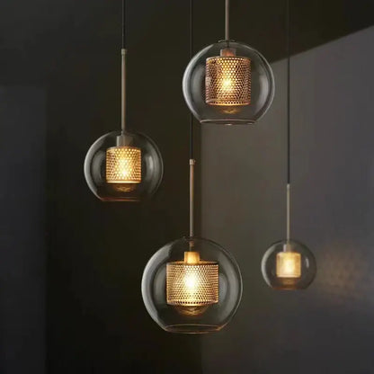 Modern gold honeycomb glass pendant lights with warm-toned textured brass mesh shades for dining room fixtures