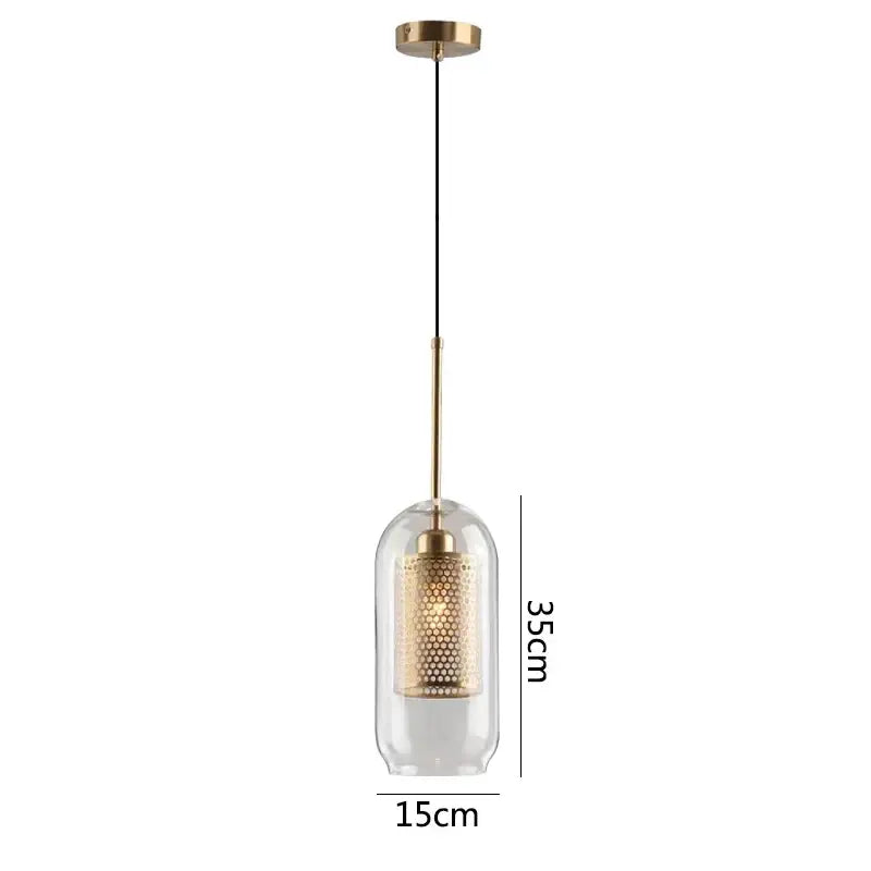 Modern gold glass pendant light with clear dome, brass rod, and honeycomb-patterned diffuser for dining room fixtures