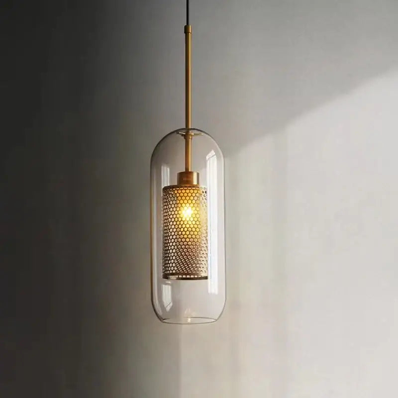 Modern gold honeycomb glass pendant lights featuring clear glass pendant with brass metal rod and mesh shade for dining room