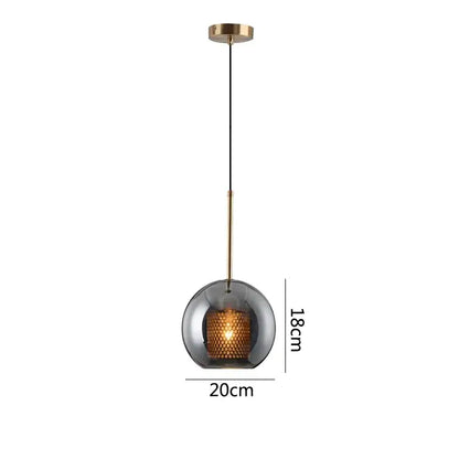 Modern gold honeycomb glass pendant lights featuring a spherical smoked glass pendant with brass rod for dining rooms
