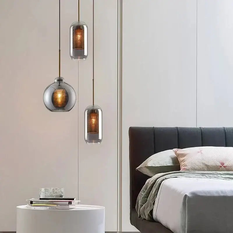 Three modern gold honeycomb glass pendant lights with frosted shades and warm lighting for dining room use