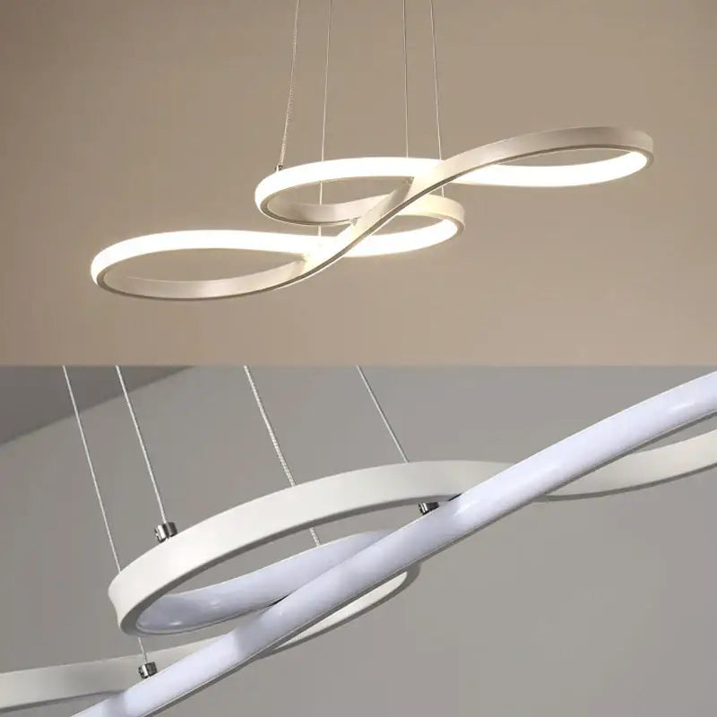 Modern gold infinity cord pendant light with sleek white rings and brushed nickel accents for dining room lighting