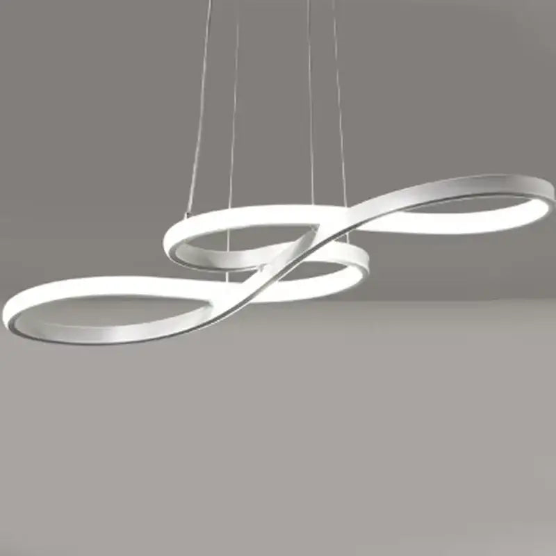 Modern gold infinity cord pendant light with sleek brushed nickel rings and integrated led for dining room