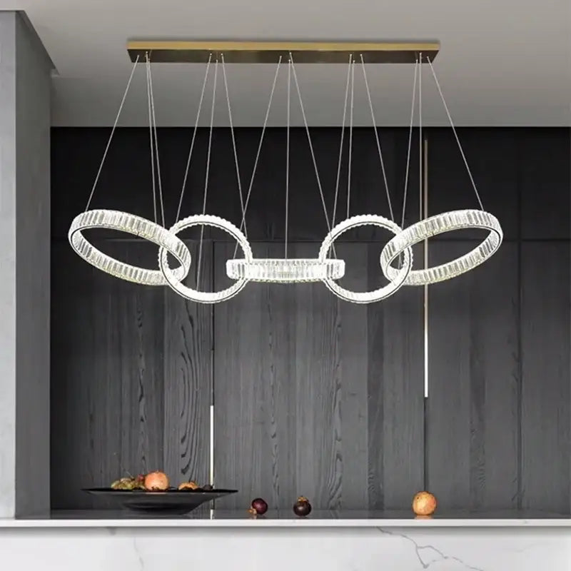 Modern gold-toned decorbites crystal chandelier pendant light with clear faceted crystals for living room ceiling lighting