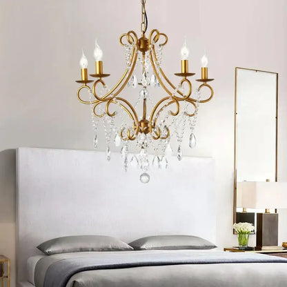 Antique brass iron crystal chandelier with dangling crystal droplets and five candle-style bulbs for luxury dining decorbites iron crystal