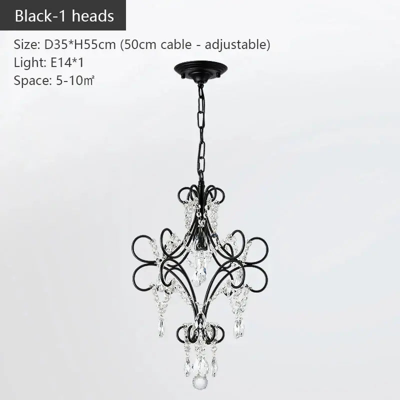 Modern gold iron crystal chandelier featuring black wrought iron scrollwork and crystal droplets for luxury dining decorbites iron crystal lighting