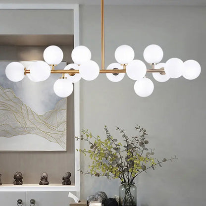 Modern gold island pendant light featuring a brass-toned chandelier with frosted glass globes 220v-240v 110v-120v
