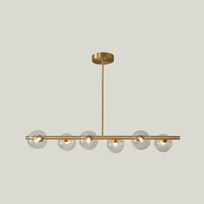 Modern gold island pendant lighting featuring a brass linear design with six clear glass globe bulbs for dining rooms
