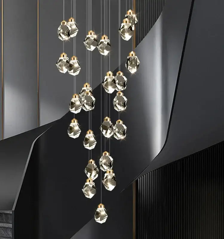 Modern gold k9 crystal linear kitchen pendant light with faceted clear glass pendants and gold fixtures emits warm light 3200k