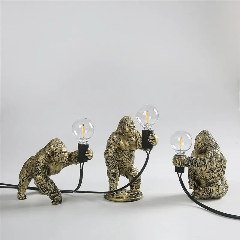Three golden king kong resin night light figurines holding edison filament bulbs for modern decorbites bedroom lamp