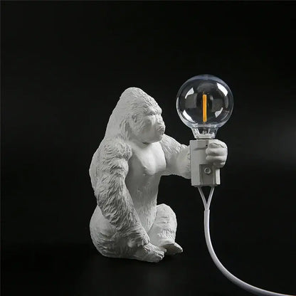 White resin king kong resin night light by decorbites holding a clear glass bulb with orange filament for bedroom decor