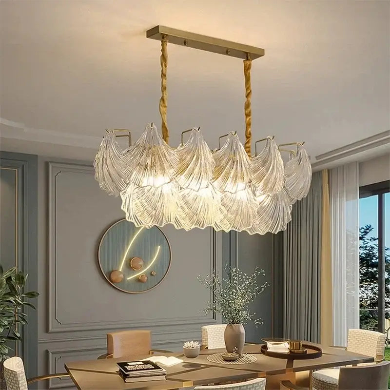 A modern gold crystal glass chandelier with decorbites crystal glass leaf shades for dining room lighting