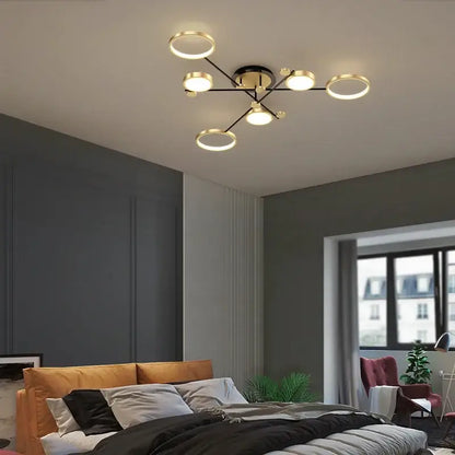 Modern gold led ceiling lamp with black and gold finish and geometric circular and spherical bulbs for living room