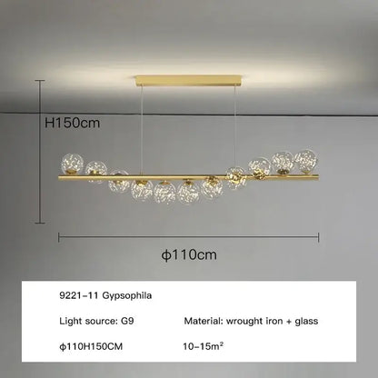 Modern gold led long chandelier featuring decorbites glass ball globe shades with a wrought iron bar pendant light