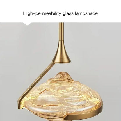 Modern gold led pendant lamp with a golden-toned high-permeability glass lampshade for dining room decorbites gold led