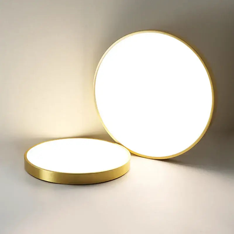 Modern gold led round ceiling light with a sleek metallic frame and bright white illumination for bedroom use