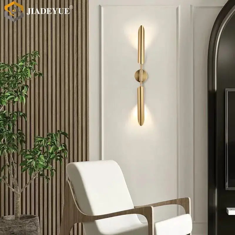 Modern gold led single head wall lamp with gold-toned minimalist vertical bars and central circular accent decorbites wall lamp