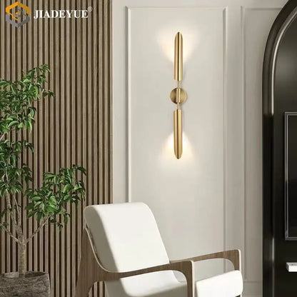 Modern gold led single head wall lamp with gold-toned minimalist vertical bars and central circular accent decorbites wall lamp